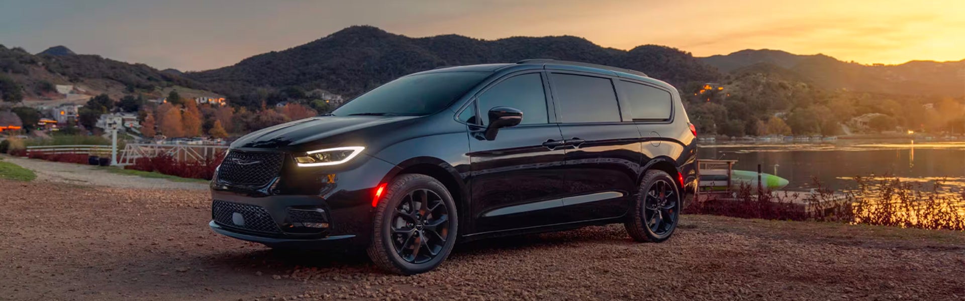 2025 Chrysler Pacifica parked near a lake at sunset