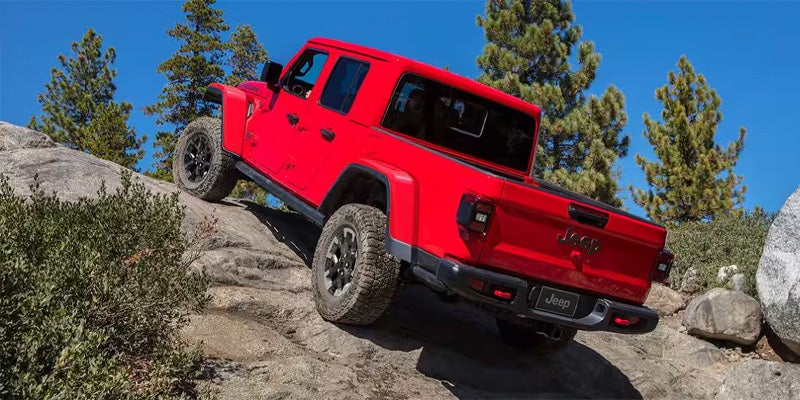 A red jeep Gladiator off roading