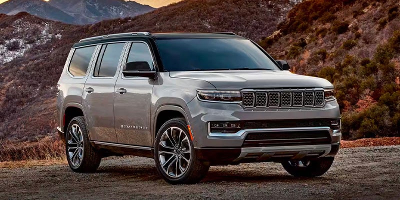 Gray 2025 Jeep Grand Wagoneer running offroading in mountain area