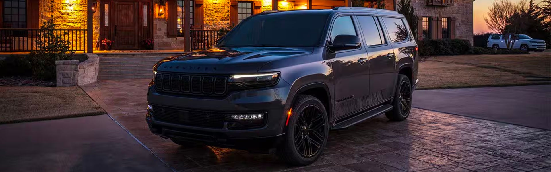 Black 2025 Jeep Wagoneer standing outside home