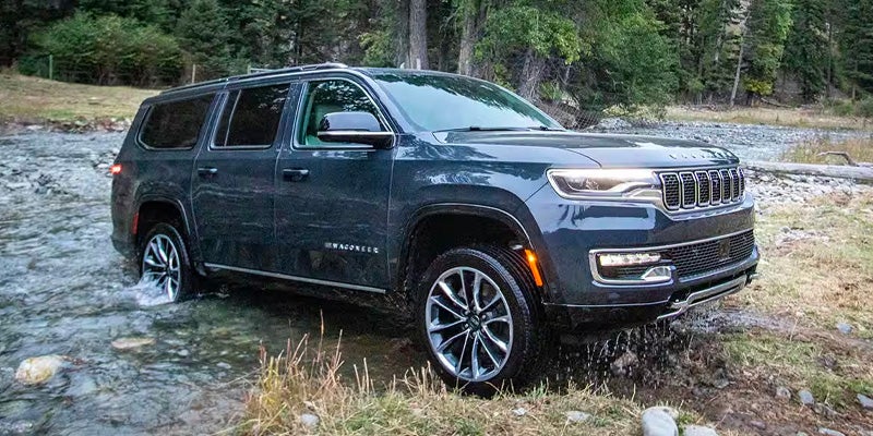 Blue 2025 Wagoneer running offroad